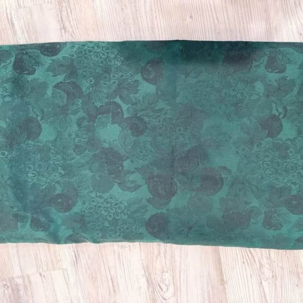 Dark green textured tablecloth